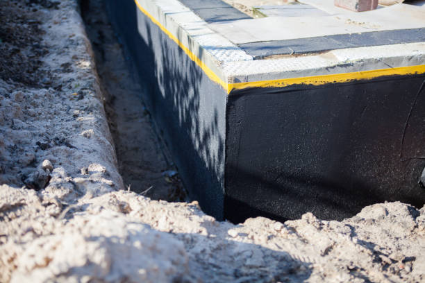 Professional Waterproofing technician working in Dover, KY